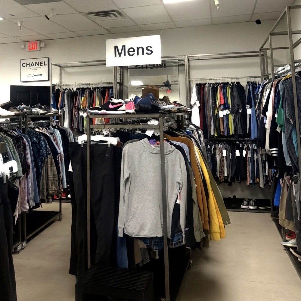 The mens section at Silk & Stone, with racks of shirts, jackets and denim under a Mens sign